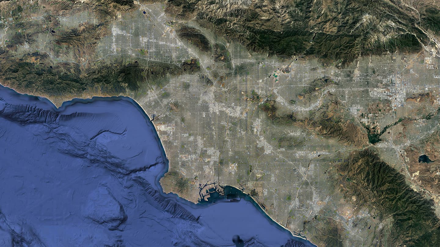 Triplet of images, starting with a satellite view of LA, unaltered in the first frame, the image then undergoes a striking transformation, compressing horizontally, and with the transformation the city’s greenery—parks, forests, and other natural areas—seemingly dissolves away as if subtly edged out of existence. This visual shift represents a real-world human mindset: the prioritization of human living space over natural landscapes. When the image expands, revealing newfound space, the instinct isn't to restore nature. Instead, it's seen as room for more urban development, reinforcing the narrative of human dominance and expansion over nature.